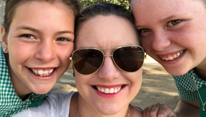 Elizabeth smiling with her two children