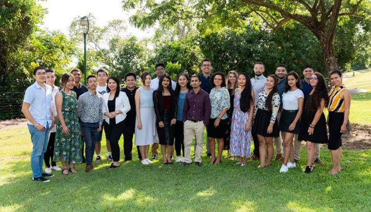 Coco standing with her friends.