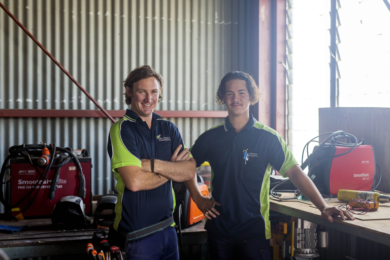 Yron smiling with his apprentice