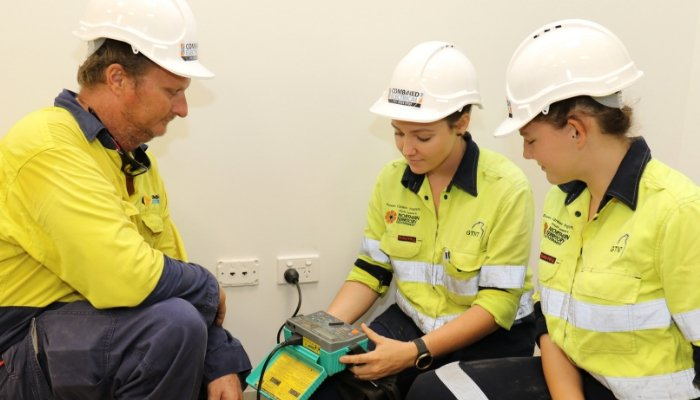 CDU VET students Stacey and Olivia working on an electrical switchboard