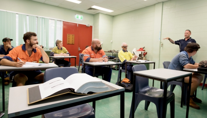 VET classroom with students listening to a teacher