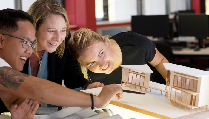 Students looking at architectural models