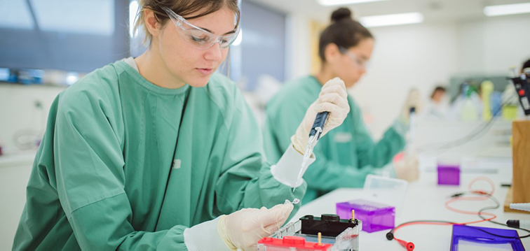 Two biomedical scientists in the lab