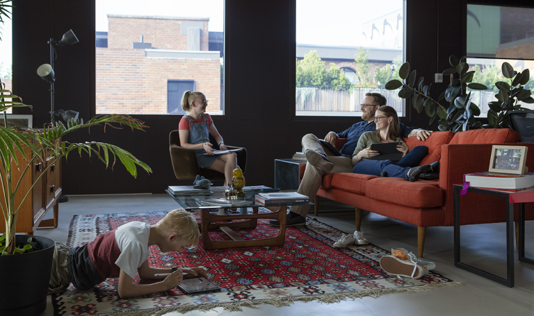 CDU student Michelle in the living room with her family