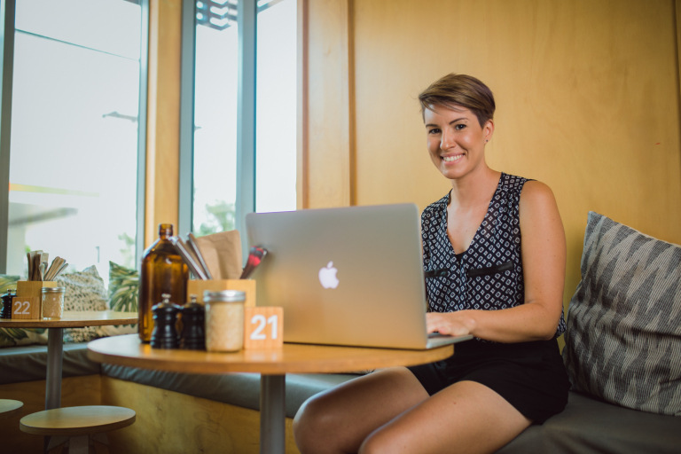 Arts student Ally studying online in a cafe