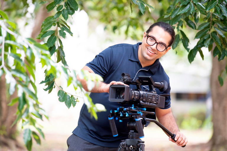 Arts degree student with film equipment