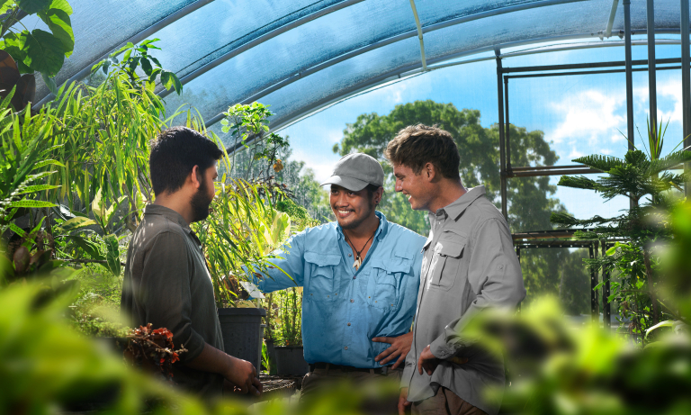 Conservation student AJ in greenhouse