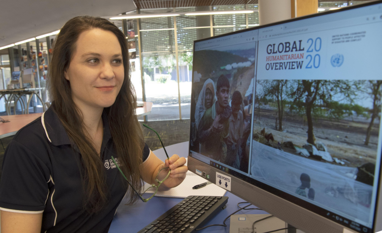 Disaster management student at computer