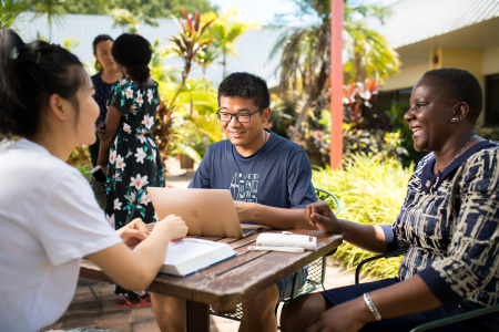 A multicultural group working to solve community problems