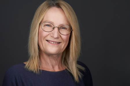 Tanya Doody head and shoulders, with plain black background