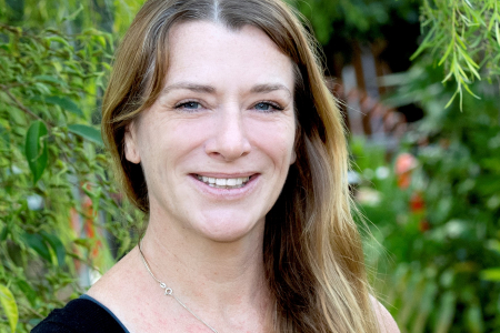 Joanne Randall head and shoulders with green leafy background