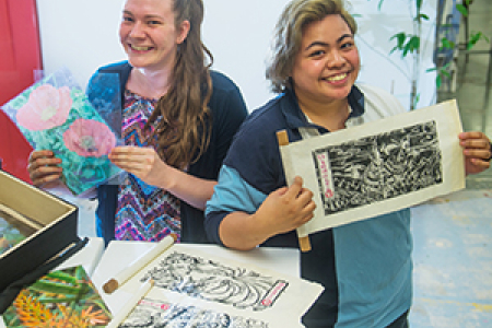 Visual arts students Kirstie Scullen (left) and Christine Barzaga will exhibit at the “Fledgling” exhibition on Friday