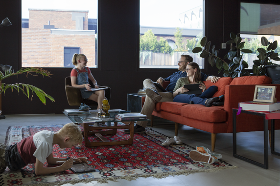 CDU student Michelle in the living room with her family