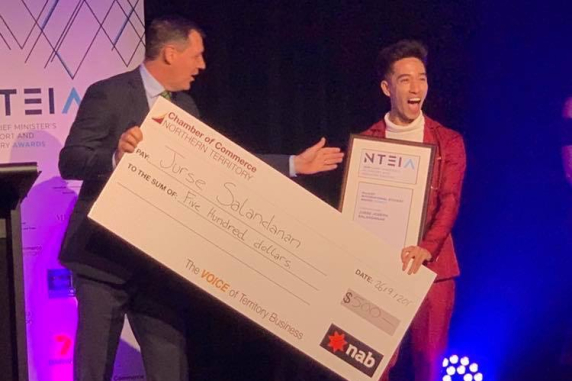 Alumni Awards finalist Jurse Salandanan winning an award