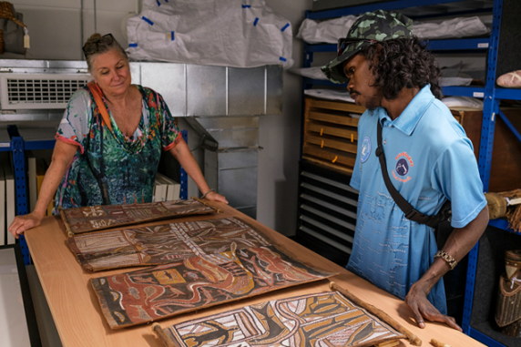 Rylson Lalara (ALC Media Unit) and Dr Joanna Barrkman, Curator view paintings in the CDU Art 