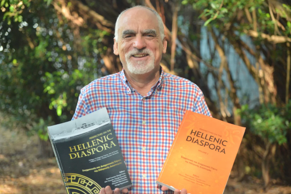 Man holding two books
