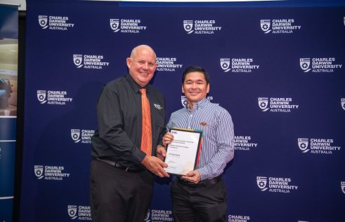 Charles Darwin University Vice-Chancellor Professor Scott Bowman with Higher Education Teaching Excellence award winner Rual David