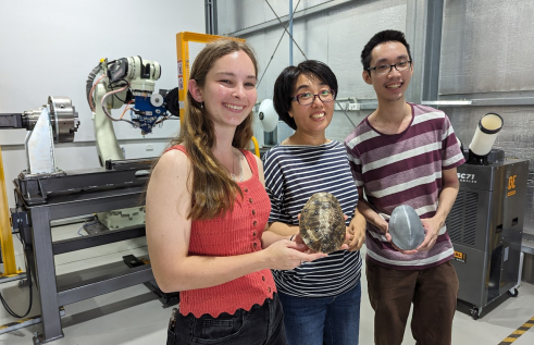 CDU student Jessie Duncan and PhD students Huifeng Wang and Cedric Tan. 