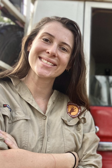 Dr Cara Penton head and shoulders with part of vehicle in background