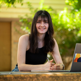 Nursing student on campus with laptop